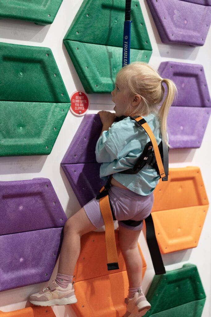 Toddler climbs the hexagon wall at Climb Up Doncaster